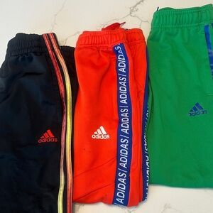 Adidas Kids Black Joggers with Red and Orange Stripes